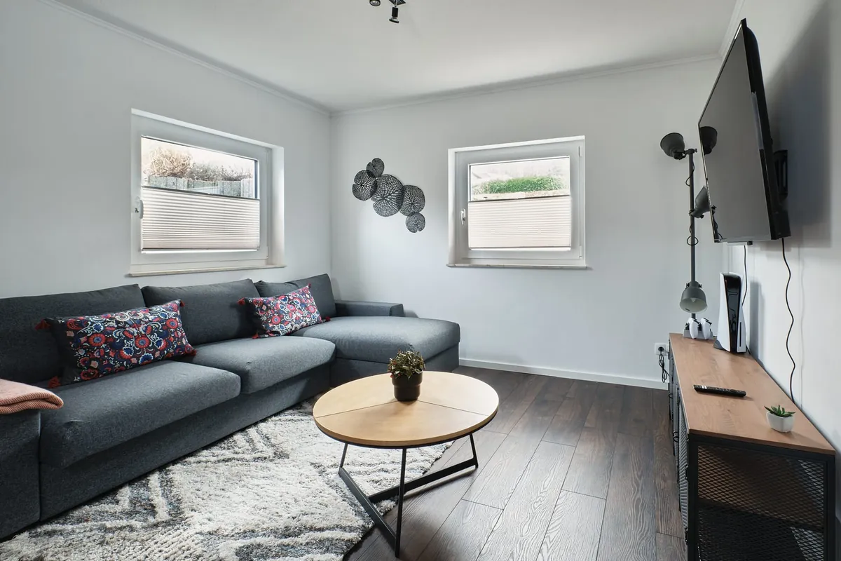 Living room with Smart TV and dining area