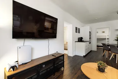 Smart TV and seating area in Landstuhl TLA apartment near Ramstein Air Base