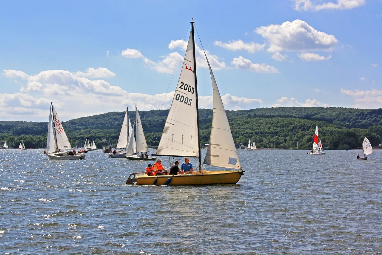 Sailing boats out on Bostalsee under a summer sky