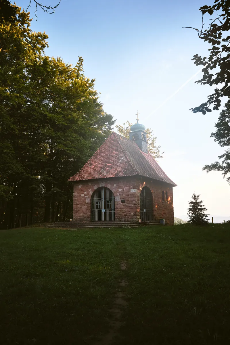 St. Anna's chapel on its hill, in low golden-hour light