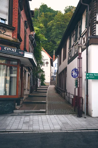 Narrow alley in Landstuhl's old town with half-timbered houses and stone steps