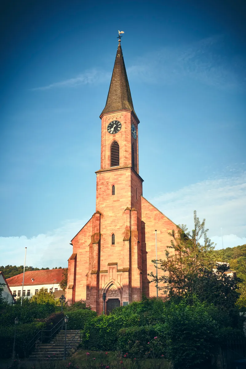 Landstuhl's Stadtkirche, a sandstone church with a clock tower
